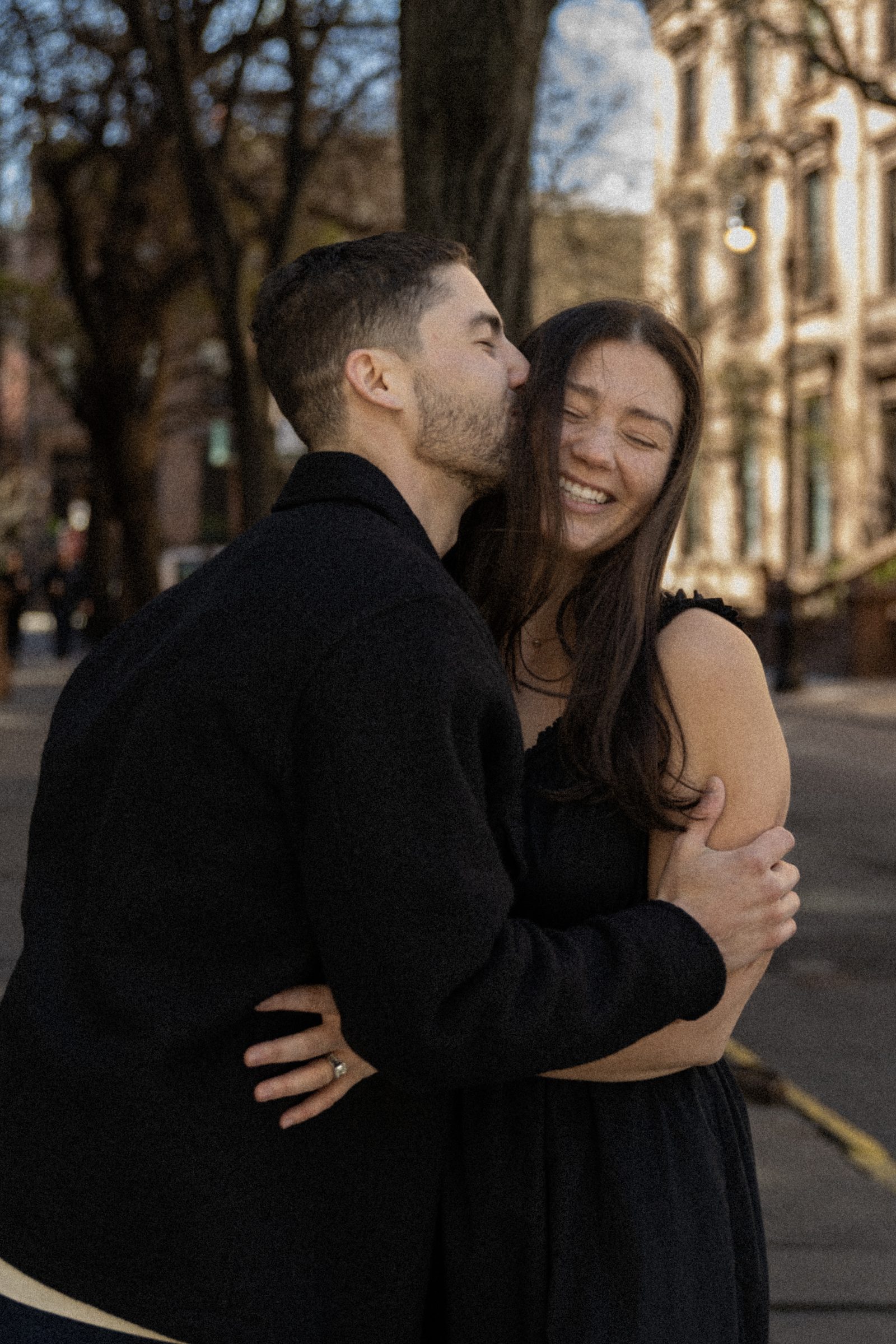 Taylor and Jake laughing together on the street